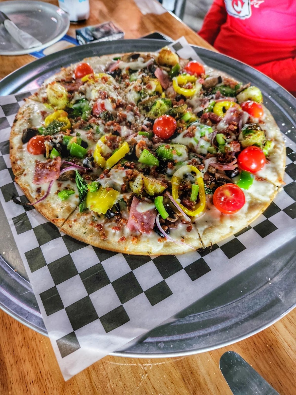 Loaded specialty pizza on the tray